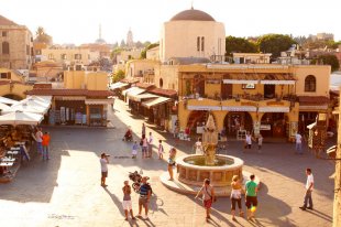 Afternoon sun on historic main square in Rhodes' Old Town. Image by Matt Munro / Lonely Planet